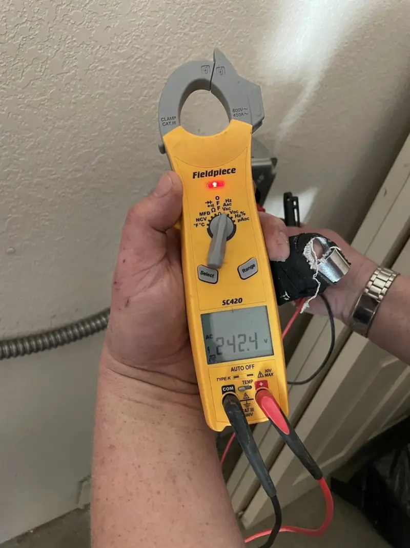 Voltage testing with clamp meter during Ceiling Fan Installation in Burgaw